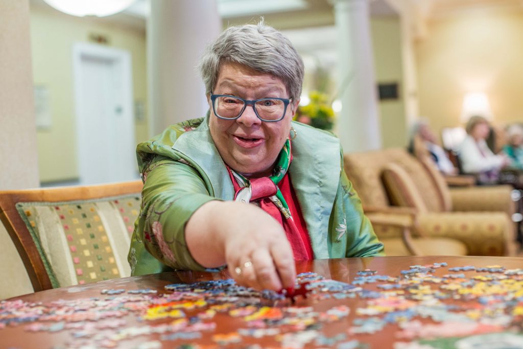 Grand Oaks resident with puzzle