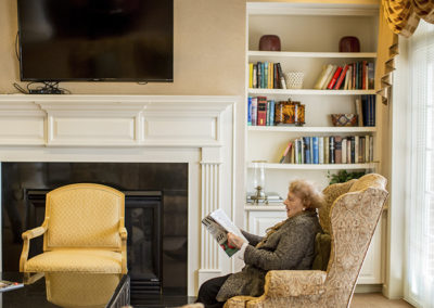 Resident reading in communal living space