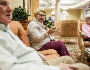 Senior living residents socializing with drinks