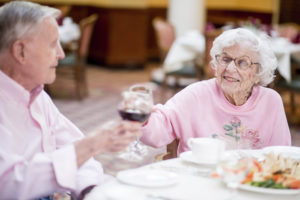 Residents toasting in dining room