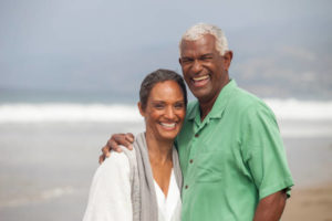 Elderly couple with good oral health smiling