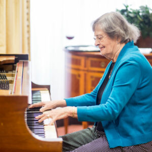 Grand Oaks resident playing piano