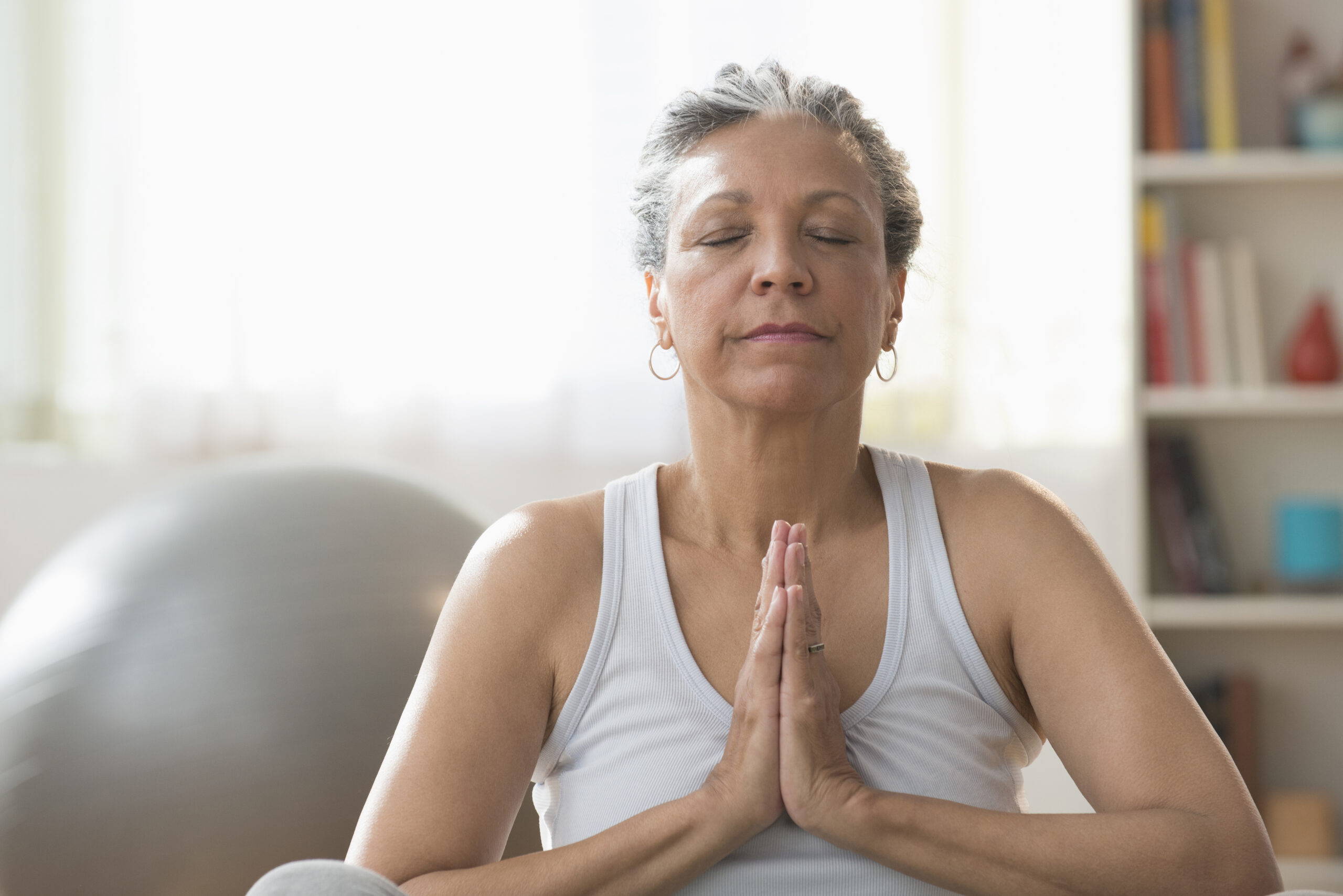 elderly woman meditating