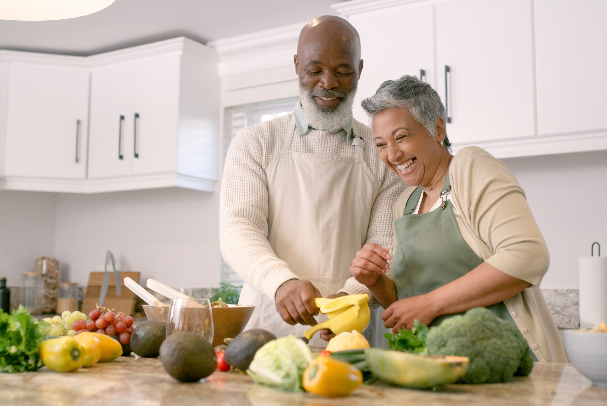 senior couple cooking healthy meal together