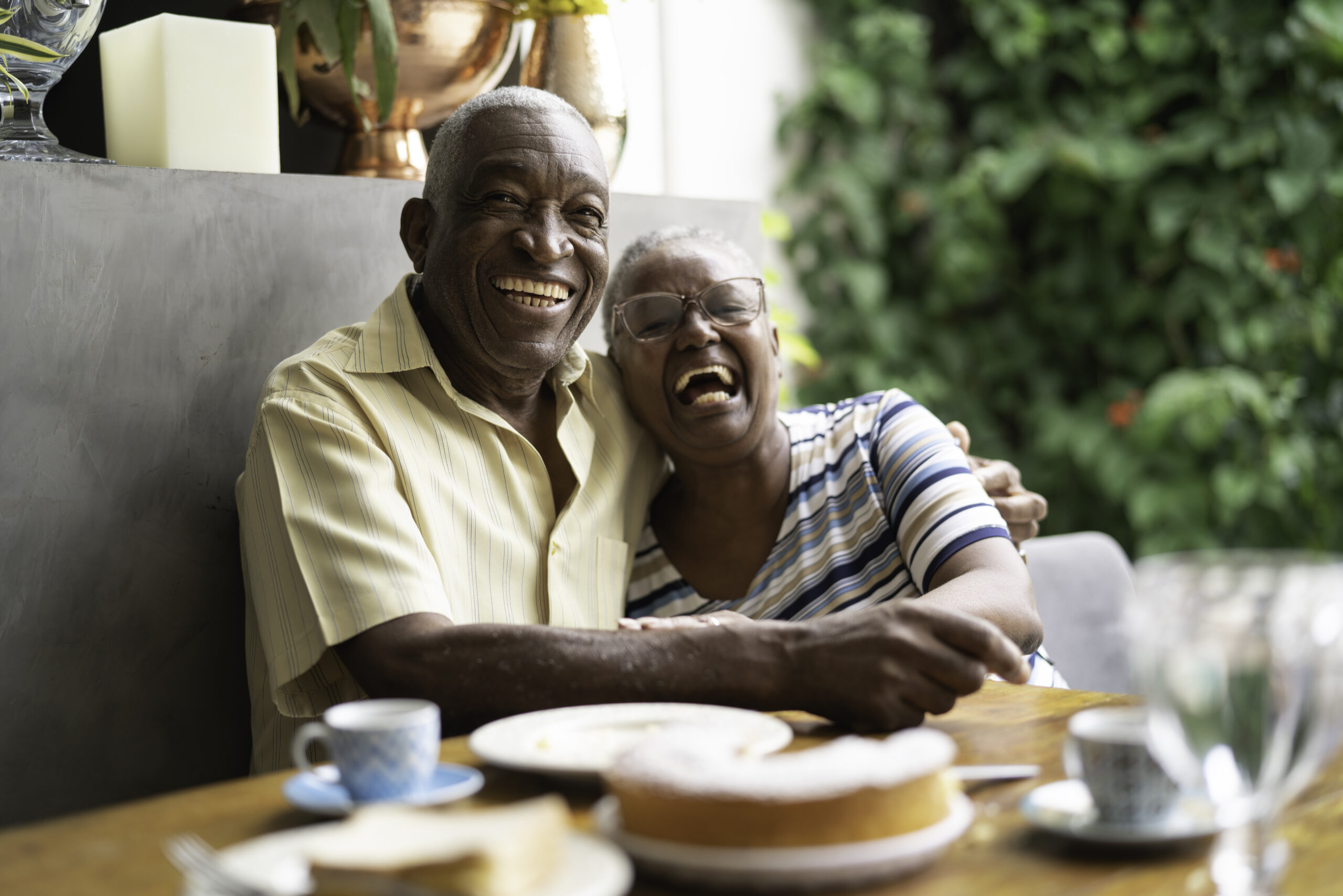 senior couple laughing together during breakfast